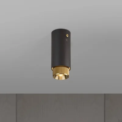 Refletor linear de exaustão para teto, aço grafite com detalhes em latão.