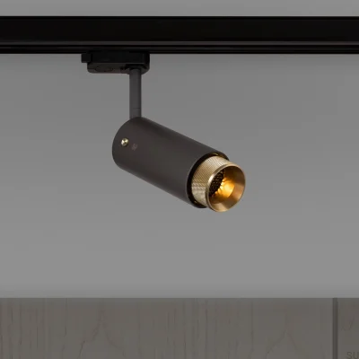 Farol auxiliar de pista transversal para escapamento, aço grafite com detalhes em latão.