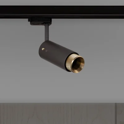 Farol auxiliar de pista transversal para escapamento, aço grafite com detalhes em latão.